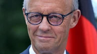 Under-fire leader unveils sweeping reforms for Germany