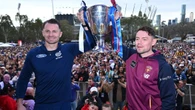Diehard fans brave the elements for grand final parade