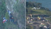 Delicate rescue underway for hurt paraglider stranded on cliff face