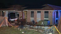 Luxury car crashes into house and lands on bed
