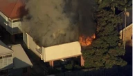 Man killed, woman seriously injured as Brisbane unit engulfed by flames