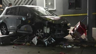 Man whose car hit US crowd reportedly shot