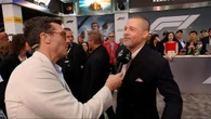 Brad Pitt reveals reason for his new buzzcut as he chats to David Woiwod on the red carpet
