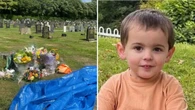 Boy crushed by grave stone in front of family