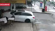 Shock footage shows miracle escape as car careens into chicken shop
