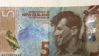 NZ central bank flags more easing after slashing interest rates