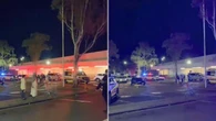 Two men stabbed during brawl outside shopping centre