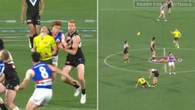 AFL umpire down in agony after centre stoppage collision