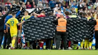 Haunting scenes after football star collapses for the second time