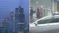 Coast drenched by mega rain bomb as search intensifies for men swept into river
