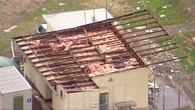Severe storms tear roof off aircraft hangars