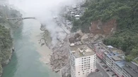 Huge landslide sends homes crashing into river in China