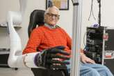 Mind-controlled robotic arm lets people with paralysis touch and feel