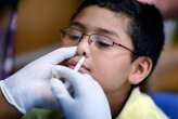 Flu vaccine for children linked to pneumonia risk for their relatives