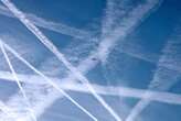 Jet contrails may cool the planet by day and warm it by night