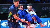 Michel Augusto torce o pé, perde o bronze no Mundial de Judô e sai carregado por adversário
