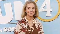 La Infanta Elena da la sorpresa en Madrid con su look más veraniego con camisa de palmeras y alpargatas de cuña sensata