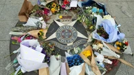Australia busca a un hombre armado mientras crece la preocupación por los extremistas que siguen teorías de la conspiración
