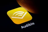 Audible is expanding its AI-narrated audiobook library