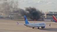 Plane catches fire on tarmac at US airport