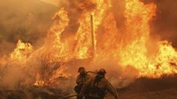 Firefighters make progress against blaze near LA that forced thousands to flee