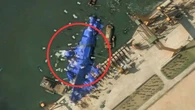 Mystery 'balloons' swarm stricken North Korean warship