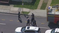 Man shot by police at fire scene in eastern Brisbane