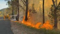 Out-of-control bushfire threatening homes in Queensland