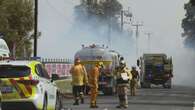 Two men arrested after grass fire in Adelaide's northern suburbs