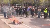 Chaos as protesters clash with police in Melbourne