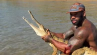 Popular US influencer facing fine for grabbing crocodile in Far North Queensland