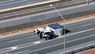 Woman questioned after man found dead on highway