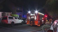 Woman killed and man hospitalised in house fire
