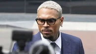 Chris Brown pleads not guilty to charges of beating music producer