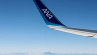 Flight from Tokyo diverted after passenger tries to open exit doors