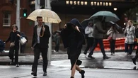 Sydneysiders face train delays, road closures as rain system moves south