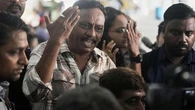 Death toll in Indian plane crash climbs as authorities race to identify victims
