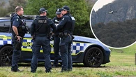 Manhunt for 'heavily armed' accused cop killer into second day