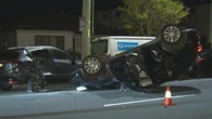Allegedly drunk driver returns to scene of crash after crashing into postal van, parked car