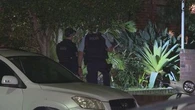 Manhunt after trio storm home with machetes in Sydney's east
