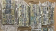 Tasmanian man arrested after $1 million found hidden in cardboard box