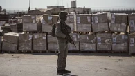 Israel says truckloads of aid waiting to enter Gaza. Why can't they bring them in?
