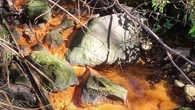 Clean-up order for council after orange sludge pumped into national park