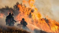 Wildfires are tearing through a popular tourist hotspot in Greece, forcing mass evacuations