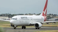 Qantas plane landed with four people out of seats after crew member broke ankle