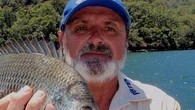 Tributes for missing radio host after coroner finds he was likely killed by croc
