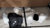Two men to face court after Sydney raids uncover $130,000 in cash, drugs