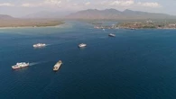 Two dead, 43 missing after ferry sinks in rough seas near Bali