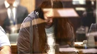 Woman accused of murdering children, leaving their bodies in luggage on trial