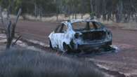 Second woman charged with murdering man found in burnt-out car in WA